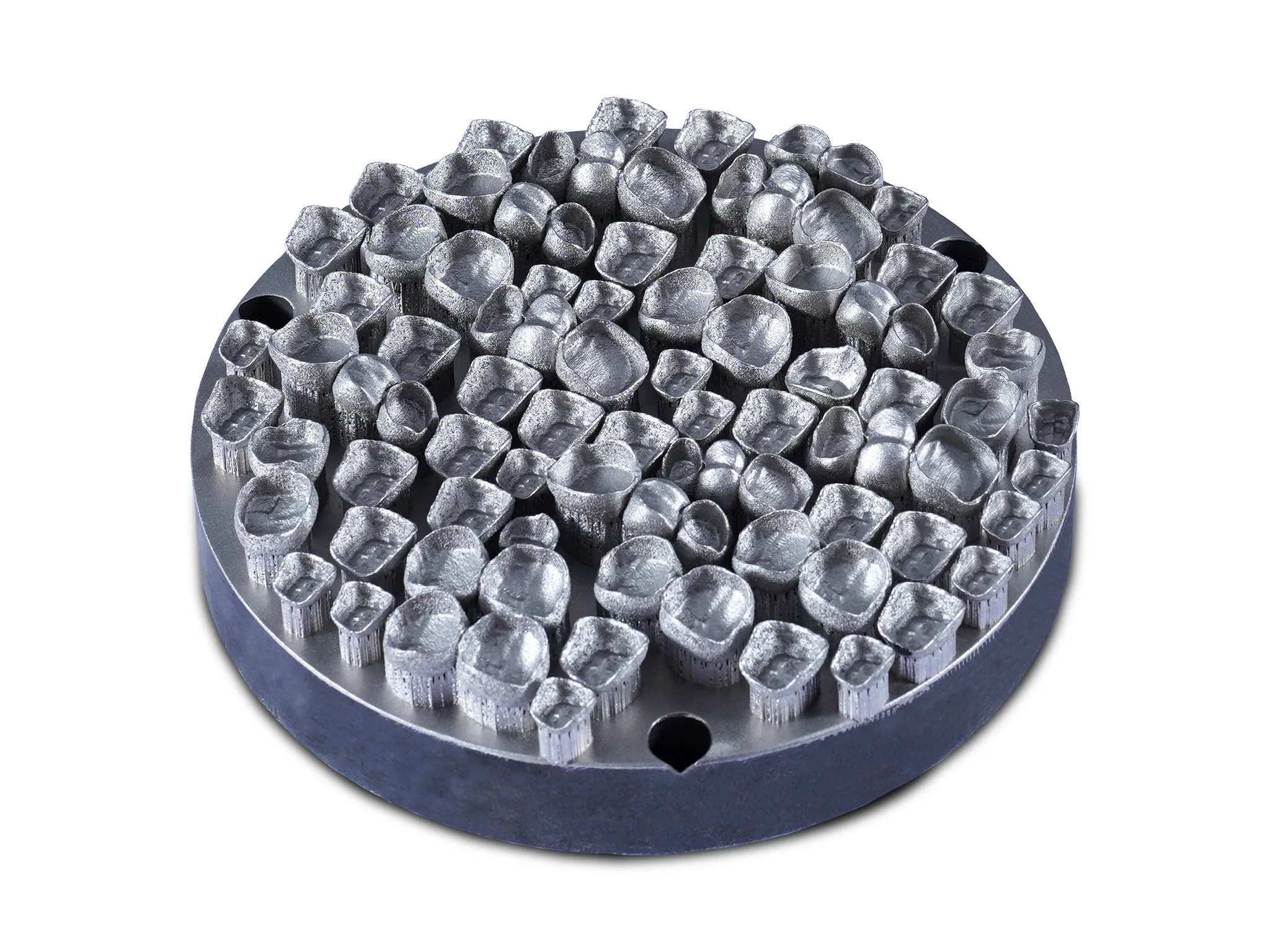 Metal 3D-printed dental crowns arranged on a build plate, showcasing precision and consistency in additive manufacturing.